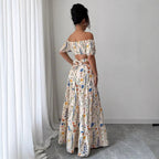 Geblümtes schulterfreies Maxi-Kleid mit Cut-Outs