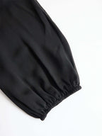 Schwarzes Chiffon-Top und weit geschnittene Hose Dreiteiliges Set