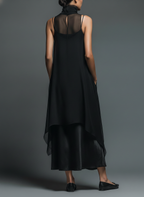 Robe sans manches en maille transparente noire pour femme avec col montant et ourlet asymétrique