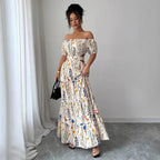 Geblümtes schulterfreies Maxi-Kleid mit Cut-Outs