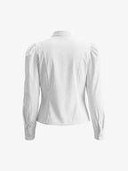 Blusa blanca de algodón con mangas abullonadas