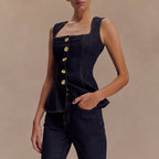Completo composto da top peplum e pantaloni in denim